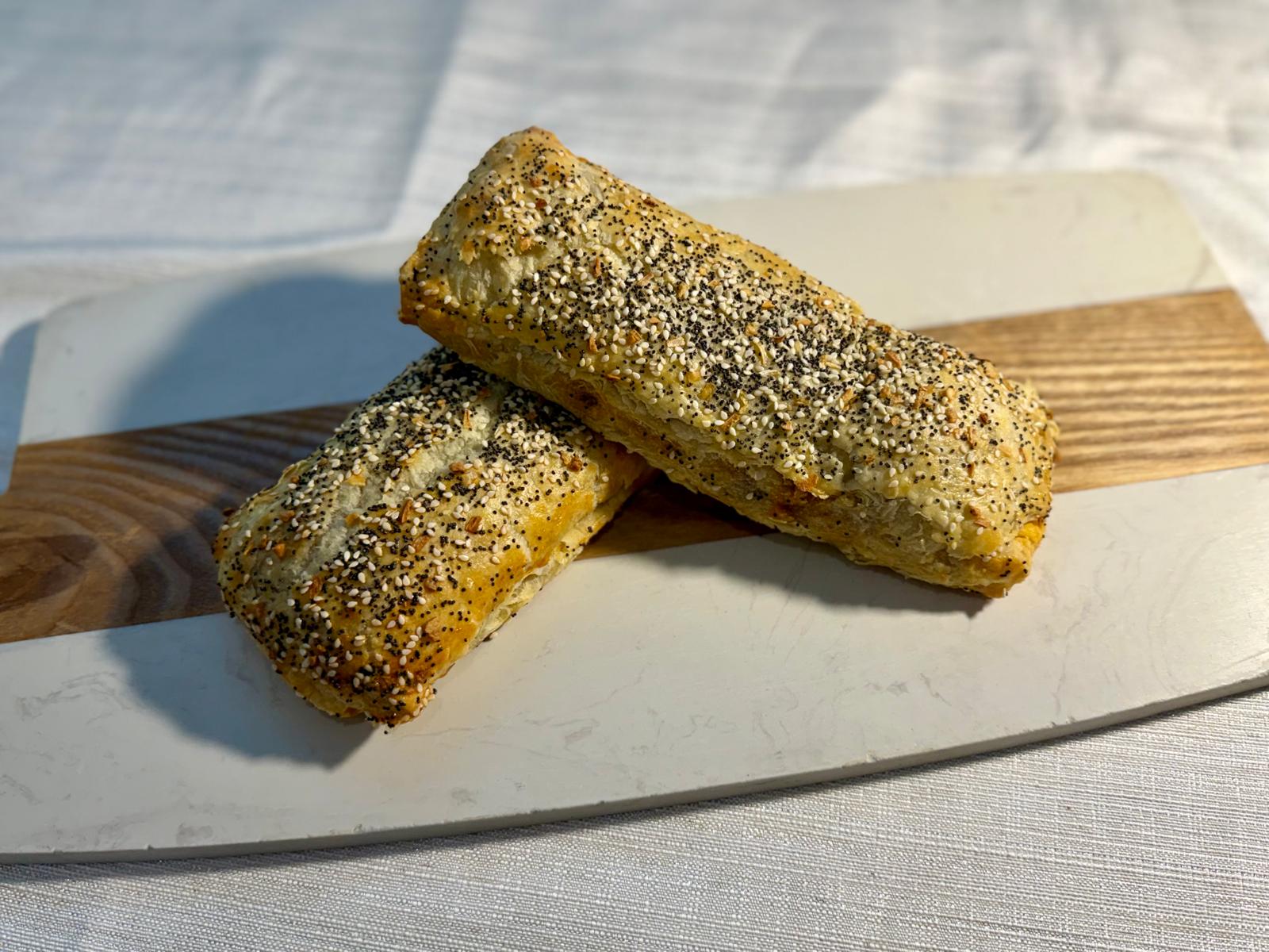 Beef roulade in puff pastry topped with sesame and poppy seeds